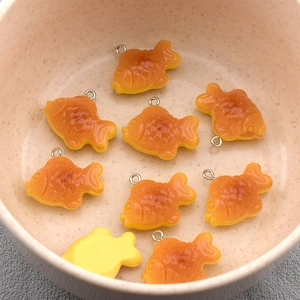 Realistic resin Taiyaki fish charms in a bowl for DIY earrings and jewelry making