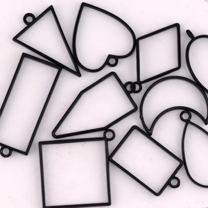 Black alloy geometric bezel charms for DIY resin jewelry in various heart and moon shapes