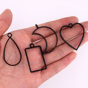 Black alloy geometric open bezel pendant set with teardrop, heart and moon shapes