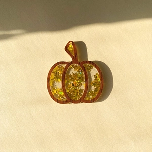 Halloween pumpkin pendant with wood frame and gold star sequins for DIY jewelry making