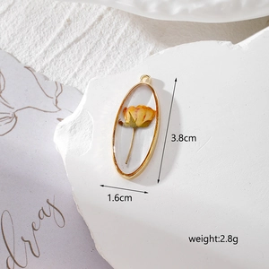 Oval gold metal pendant with dried yellow rose bud, size 3.8cm x 1.6cm for DIY jewelry