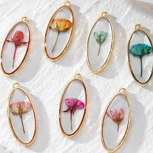 Oval dried flower resin pendants with gold alloy frame for DIY jewelry making
