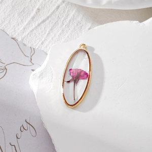 Oval resin pendant with pink dried flower and gold alloy frame for DIY jewelry making