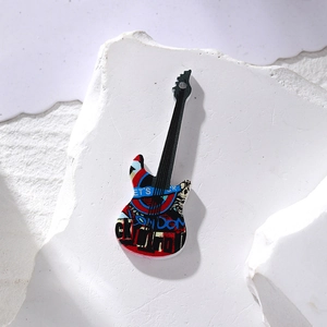 Macro detail of acrylic electric guitar charm with colorful graffiti and rock theme design