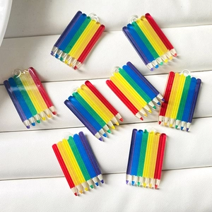 Macro shot of colorful acrylic rainbow pencil charms for DIY jewelry and keychains