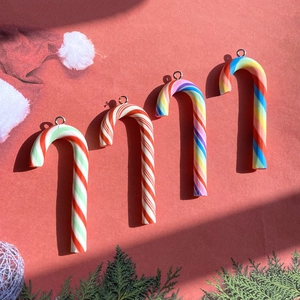 Set of four festive resin candy cane pendants with colorful stripes for DIY jewelry making