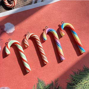 Christmas candy cane pendants with rainbow spiral patterns and silver metal rings