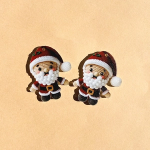 Detail of Santa Claus pendants with faux crochet texture for DIY jewelry making