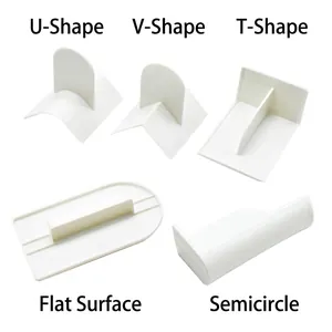 Five-piece set of white plastic cake scrapers with various geometric shapes and flat edges