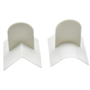White silicone furniture corner protectors in flat and rounded shapes for child safety