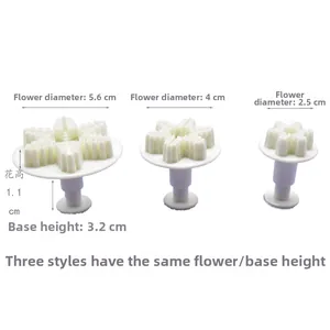 Three-piece snowflake plunger cutter set with 5.6cm, 4cm, and 2.5cm diameters for baking
