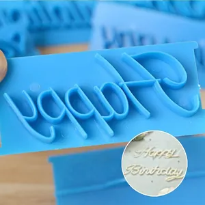 Blue plastic cake letter stamp with Happy Birthday embossing effect for baking