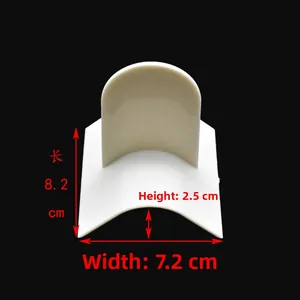 Detailed view of cream plastic curved shaping tool with 8.2cm x 7.2cm dimensions
