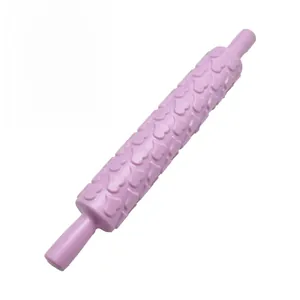 Detail of a purple heart-patterned rolling pin for cake fondant and DIY baking tool
