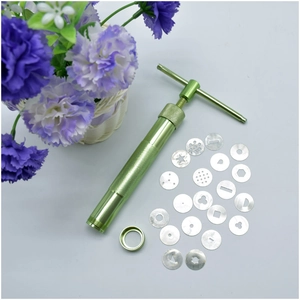 Macro shot of green clay extruder tool with 20 stainless steel pattern discs on white background