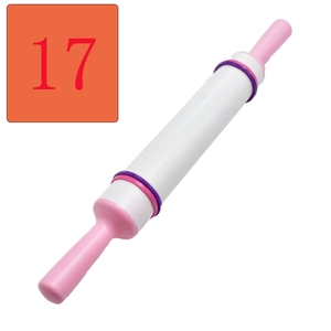 Detail of DIY fondant rolling pin with adjustable rings and textured floral patterns