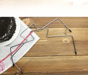 Detailed close-up of stainless steel cake slicer with adjustable wire height levels