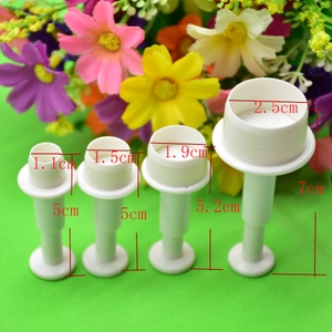 Detail of 4pcs white spring-loaded fondant molds with specific size measurements