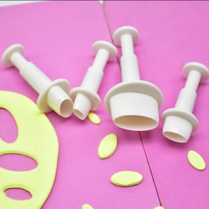 Set of 4 white oval spring-loaded plunger cutters for fondant cake and cookie decorating
