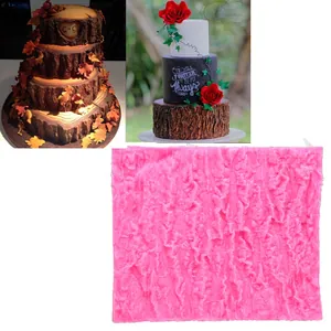 Detail of pink silicone mat featuring deep realistic tree bark texture for cake fondant decorating