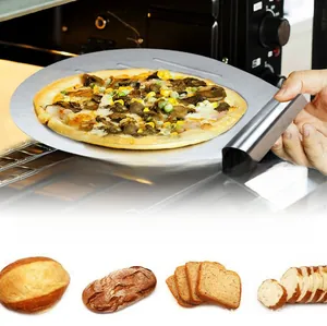 Detail of stainless steel pizza peel lifting a hot pizza from a kitchen oven