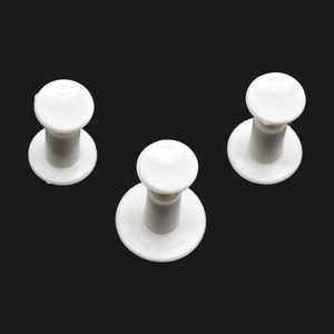 Detail of 3-piece white geometric spring plungers for DIY fondant and cookie embossing