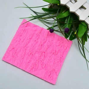 Detail of pink silicone mold with realistic bark texture for DIY cake decorating