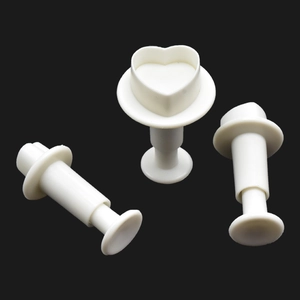 Three-piece heart-shaped spring plunger cutters for fondant and cookie dough shaping