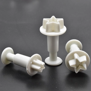 Three-piece star-shaped plunger cutters for fondant and cookie dough in white plastic