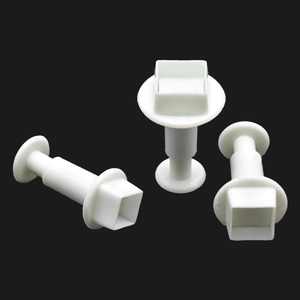 Three-piece set of white square plungers for fondant cakes and biscuit dough cutting