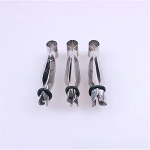 Detail of three stainless steel precision tweezers with non-slip handles and rubber rings