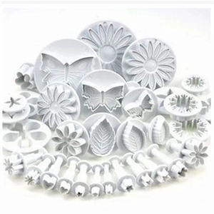 Macro detail of white plastic plunger cutters for fondant cake and cookie decorating