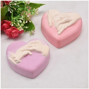 DIY heart-shaped silicone mold featuring realistic hand-holding relief patterns