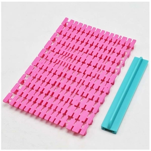 Detail of DIY alphabet cookie stamp set with pink grid plate and blue plastic holder