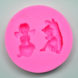 Detailed top view of a pink silicone mold with two cute angel cavities for DIY crafts