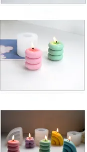 Macro view of macaron colored cube candles and white silicone molds for DIY candle making