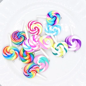 Detailed view of colorful swirl resin lollipop charms with metal hooks for DIY jewelry making