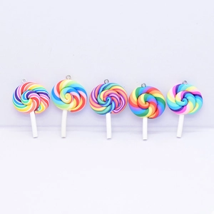 Detailed close-up of five colorful resin lollipop charms with metal loops for DIY crafts