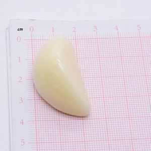 Realistic PVC garlic food pendant for DIY earrings and keychains on a measuring scale