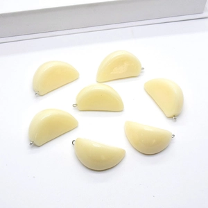 Set of 7 realistic garlic clove charms in cream yellow resin with silver metal jump rings