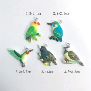 Set of five colorful resin bird pendants with detailed feathers for DIY jewelry making