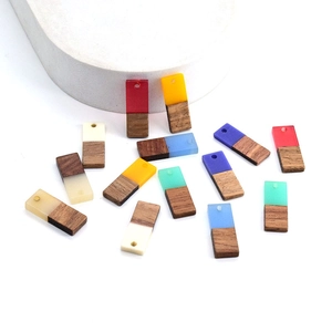 Macro view of rectangular resin and wood geometric pendants with pre-drilled holes