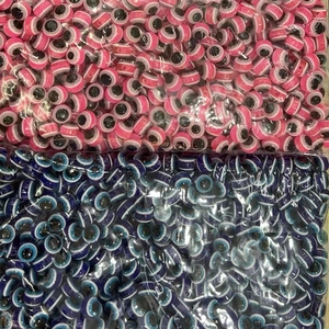 Bulk resin evil eye beads in pink and blue for DIY jewelry making and craft projects