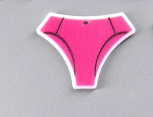 Close-up of hot pink thong-shaped acrylic pendant with hanging hole and black trim detail
