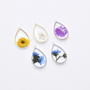 Five teardrop resin pendants with real dried flowers and alloy frames for DIY jewelry