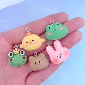 Macro detail of cute resin animal charms featuring rabbit bear and frog for DIY jewelry