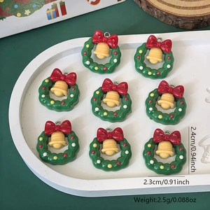 Christmas wreath pendants with red bows and yellow bells for DIY jewelry making