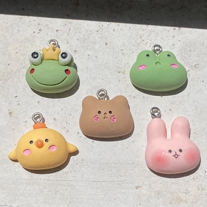 Close-up of cute resin animal charms featuring rabbit frog bear and chick for DIY crafts