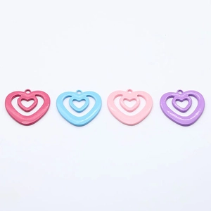Set of four hollow alloy heart pendants in macaron colors for DIY jewelry making crafts