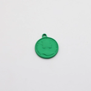 Close-up of green round coin pendant with Elizabeth II relief for DIY jewelry